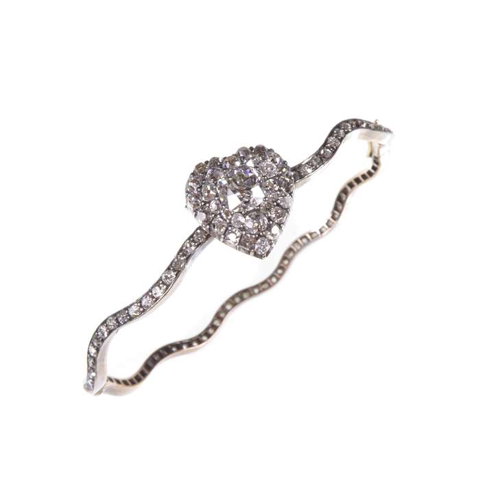Diamond set bangle with a bombe heart shaped locket panel